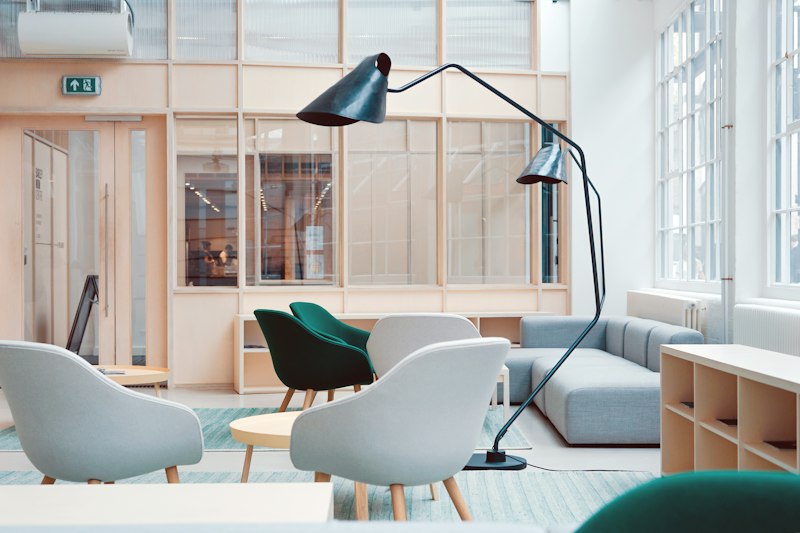 Dining nook with wooden chairs and window light