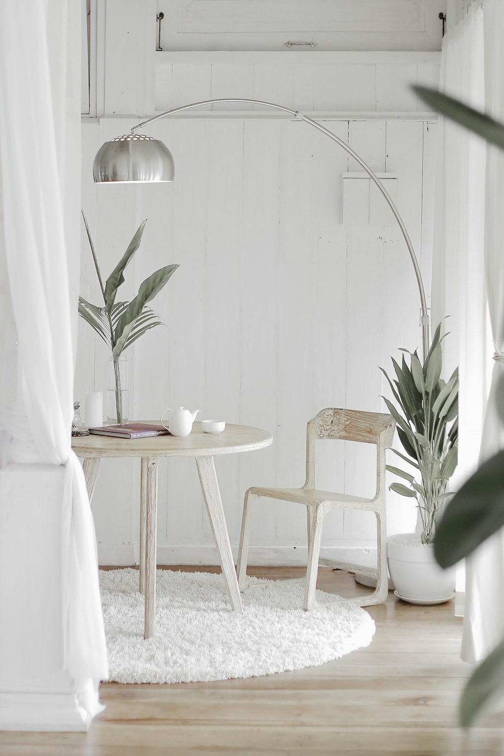 Warm dining corner with wooden table and autumn decor